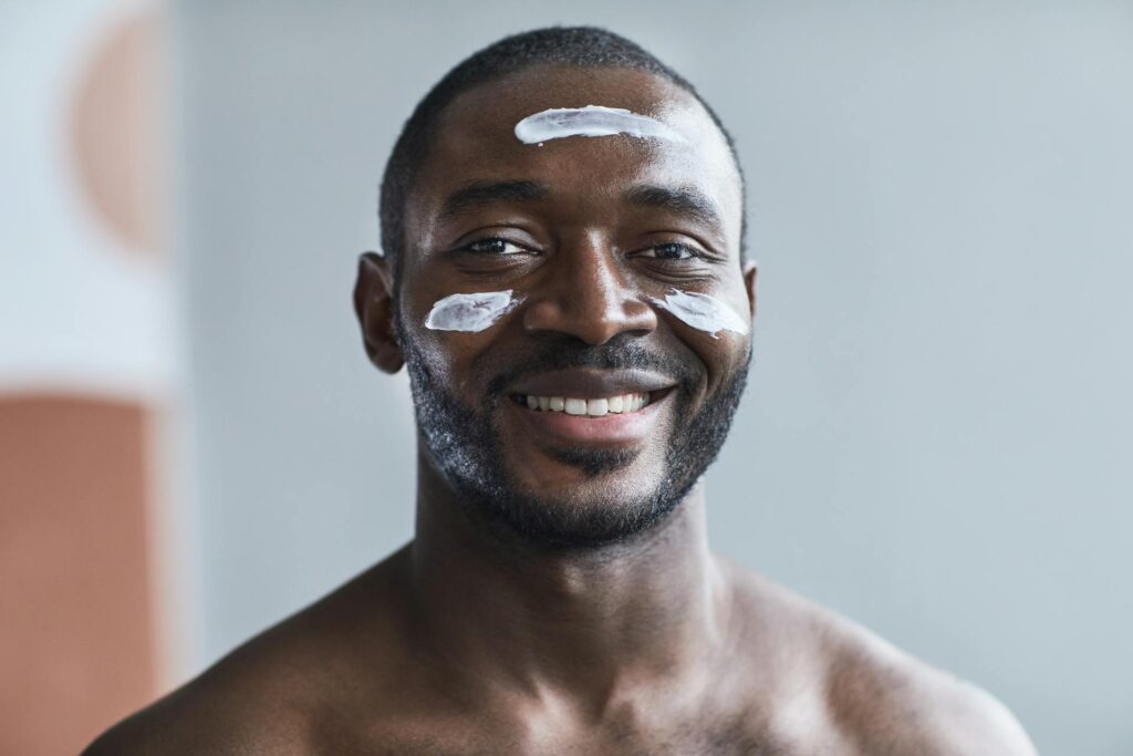 applying eye cream for men’s evening skincare routine