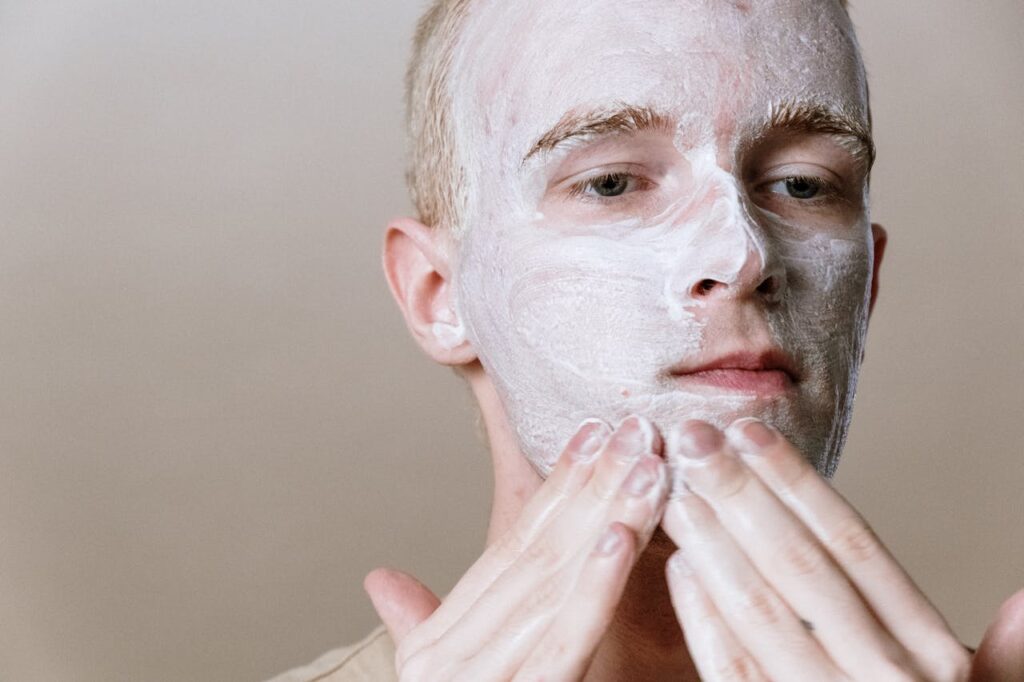 man applying night moisturizer as part of evening male skincare routine